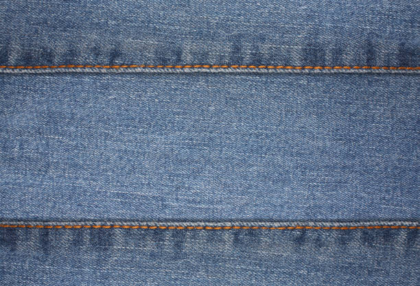 istock jean Denim fabric with wrinkles background texture 1175205930