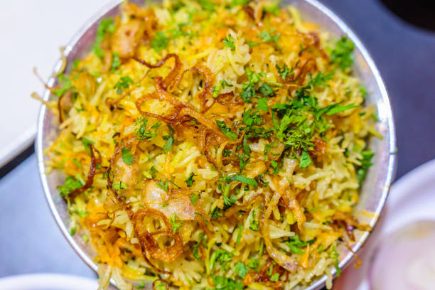 istock Chicken Biryani Indian closeup with fried onion chops used for garnish 1175207006