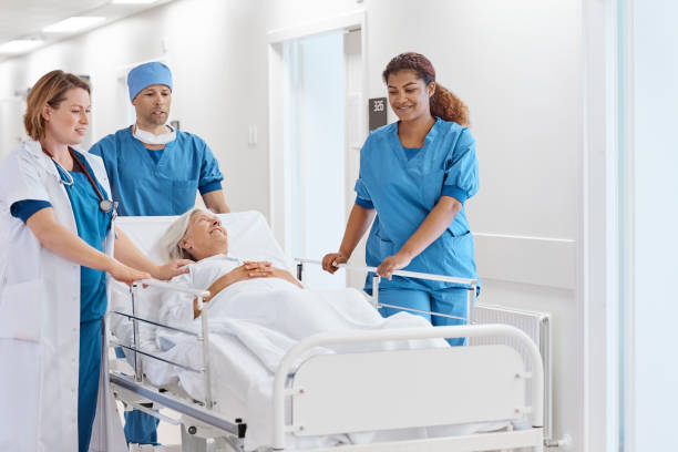 istock Surgeons pushing patient on hospital gurney 1175207615