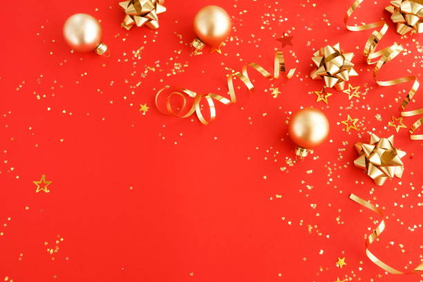 istock christmas or new year decorations background in gold colors on red  background with empty copy space for text. holiday and celebration concept for postcard or invitation. top view 1175208783