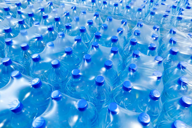 istock A lot of plastic bottles with blue caps 1175210593