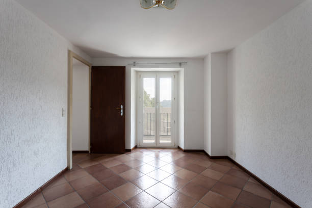 istock Front view of room with white walls and window looking nature 1175213862