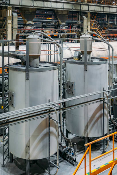 istock Steel tanks connected by pipelines in factory workshop 1175217880
