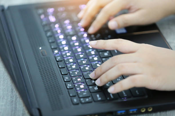 istock Cropped Hand Of Person Using Laptop On Table 1175218958