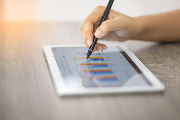 istock Cropped Hand Of Business Person Using Digital Tablet On Table 1175219504