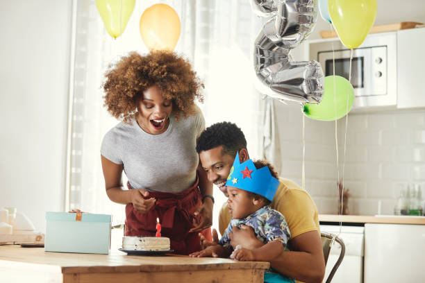 istock Excited parents celebrating birthday with son 1175221690