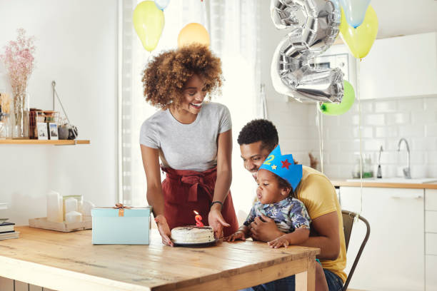 istock Cheerful parents celebrating birthday with son 1175221691