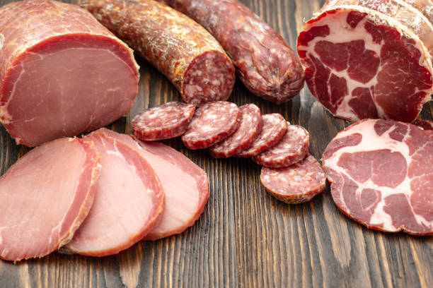 istock Antipasto platter cold meat with slices ham, beef jerky, salamon wooden board over rustic background 1175221699