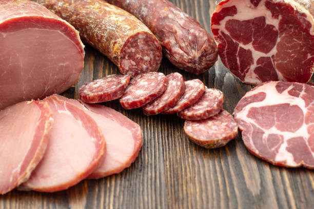 istock Antipasto platter cold meat with slices ham, beef jerky, salamon wooden board over rustic background 1175221916
