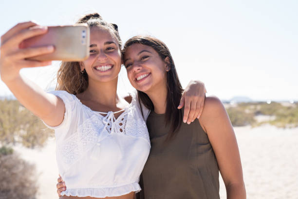istock Girls smiling and laughing as they take a selfie 1175223572