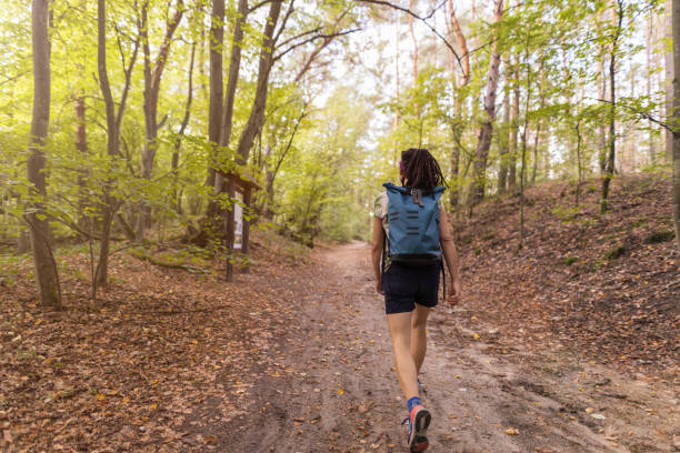 istock Young woman hiking in the forest 1175226600
