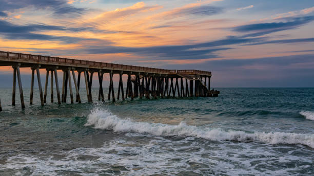istock Pier at sunset, wavy beautiful sea 1175227721