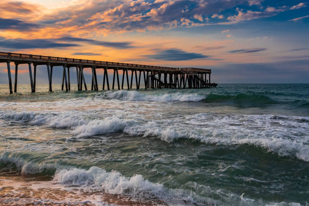 istock Pier at sunset, wavy beautiful sea 1175227796