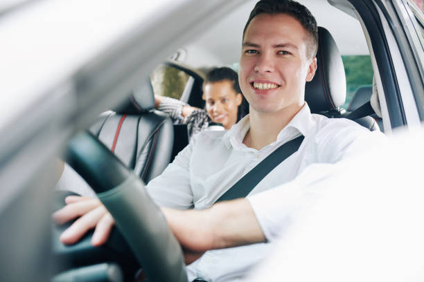 istock Man with passenger in the car 1175229123