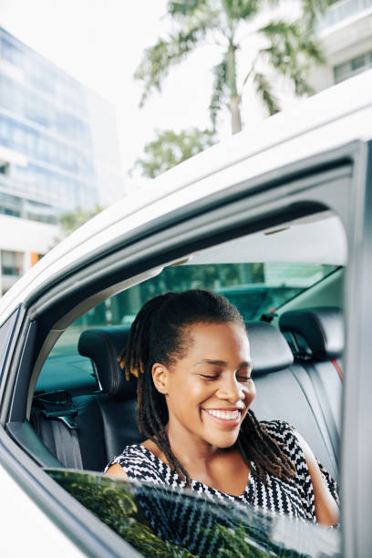 istock Happy woman using a taxi 1175229144