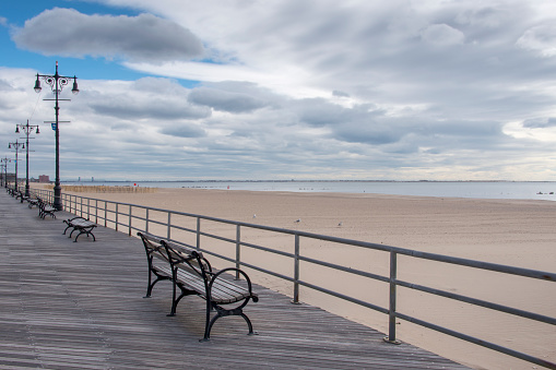 Empty benches at the Riegelmann Boardwalk at Coney Island, New York.