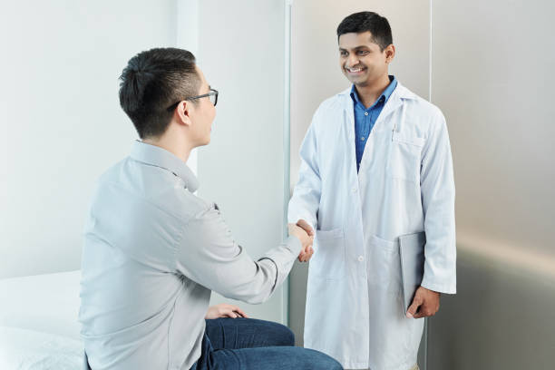 istock Doctor and patient shaking hands 1175236798