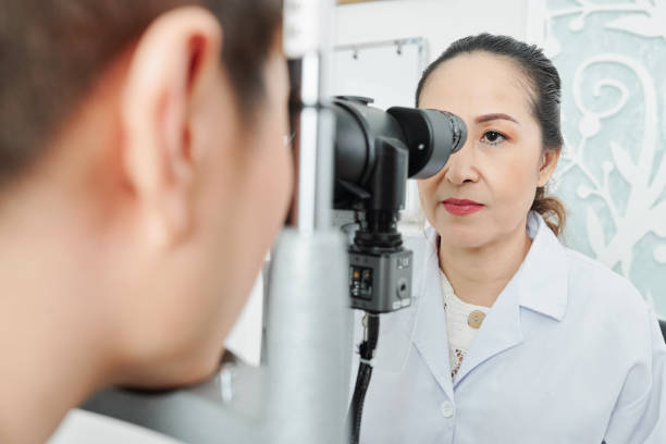 istock Asian optometrist examining the patient 1175237026