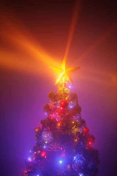 istock Christmas tree with festive lights, purple background 1175237165