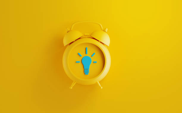 Yellow Alarm Clock on Yellow Background