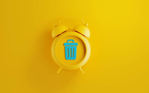 Yellow Alarm  Clock with Trash Bin Symbol on Yellow Background