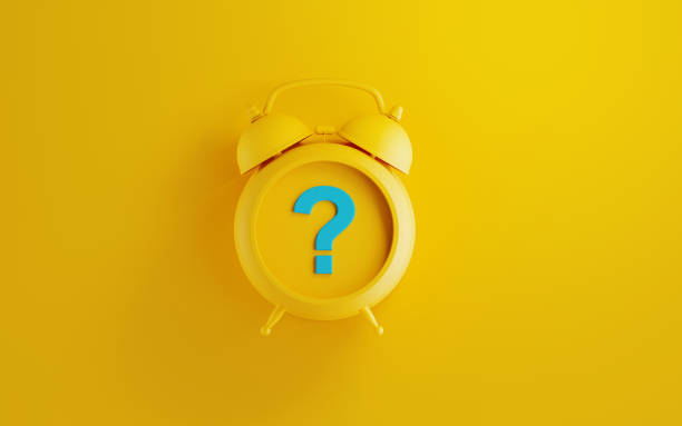istock Yellow Alarm Clock with Question Mark on Yellow Background 1175237948