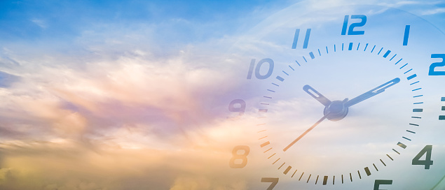 double exposure of cloudy sky and clock at ten o'clock ten minute , time passing concept