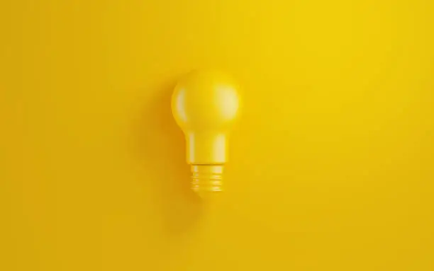 Photo of Light Bulb  on Yellow Background