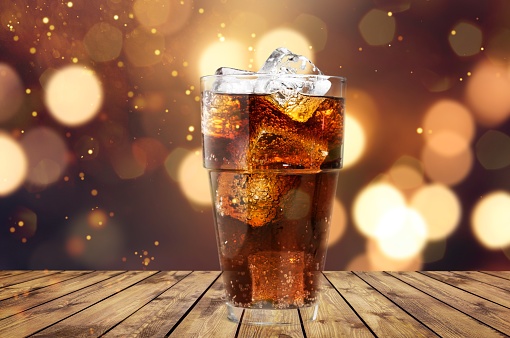 Glass of alcohol drink with cola, ice