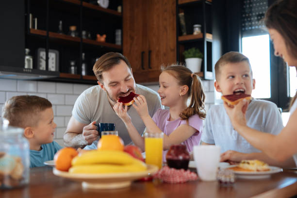 istock Family with three children having breakfast at home 1175238459