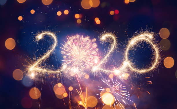 istock Sparkler Happy New Year 2020 With Fireworks 1175243186