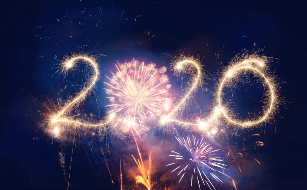istock Sparkler Happy New Year 2020 With Fireworks 1175243788