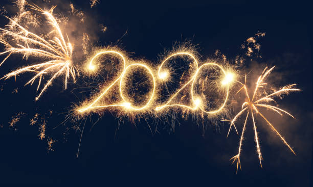 istock Sparkler Happy New Year 2020 With Fireworks 1175243973