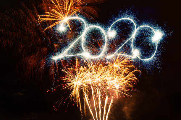 istock Sparkler Happy New Year 2020 With Fireworks 1175244753