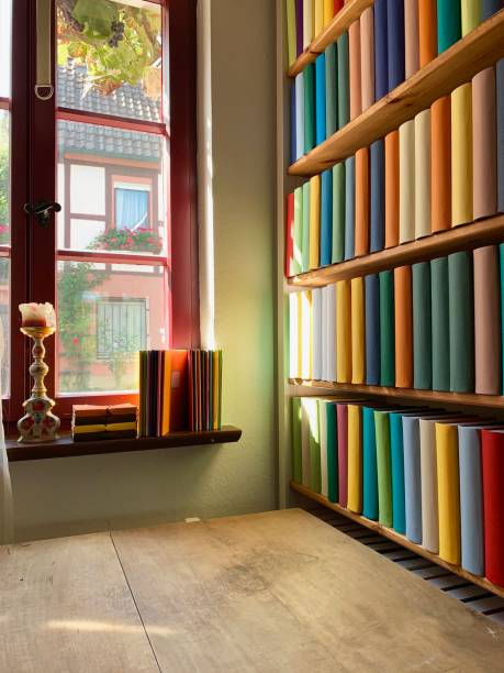 istock Table and book shelves including generic books 1175245090