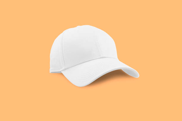 Fashion and sports white cap isolated Fashion and sports white cap isolated on beautiful pastel color background, with clipping path. white cap stock pictures, royalty-free photos & images