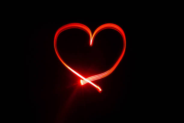 istock Heart symbol written with red lights 1175245895