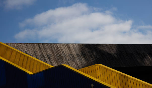 Rotterdam, Netherlands. June 27, 2019. Wooden building roof, geometric construction under blue sky, Exterior, empty wall