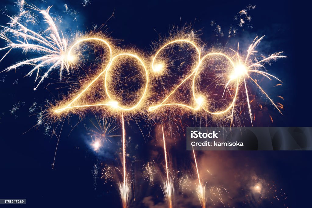 Sparkler Happy New Year 2020 With Fireworks 2020 Stock Photo