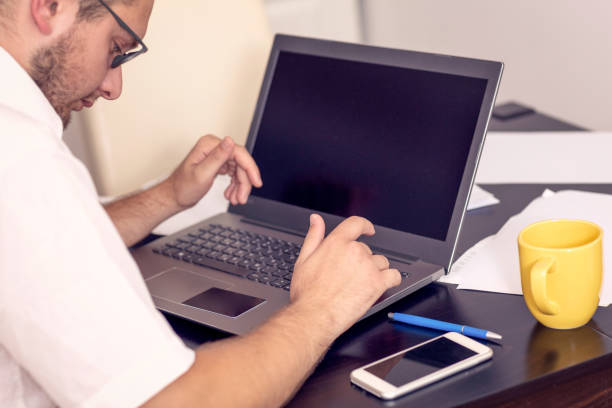 istock businessman working on laptop at home office 1175247660