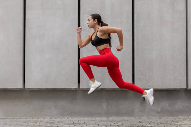 istock Young sporty woman running 1175247681