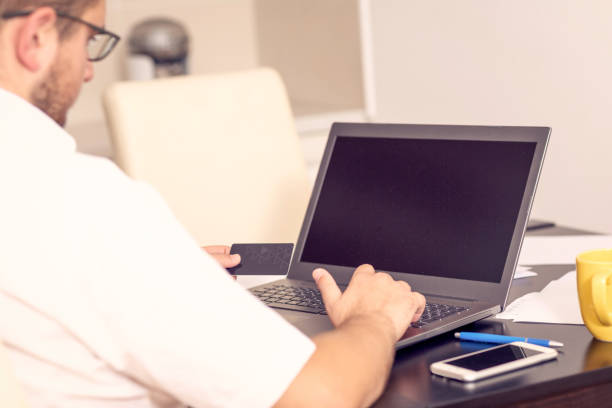istock businessman working on laptop at home office 1175247743