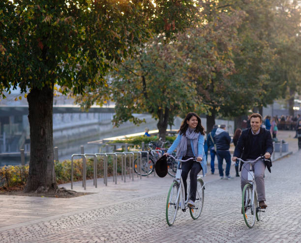 istock Couple Riding Bicycles In Autumn 1175248550