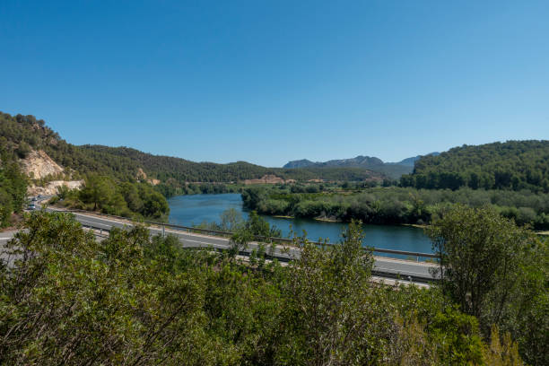 The Ebro river next to the greenway of Tarragona The Ebro river next to the greenway of Tarragona, Spain via verde spain stock pictures, royalty-free photos & images