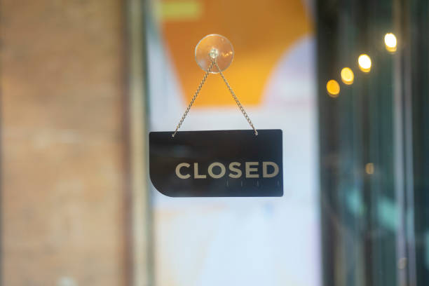 istock closed sign hanging outside a restaurant, store, office or other 1175250112