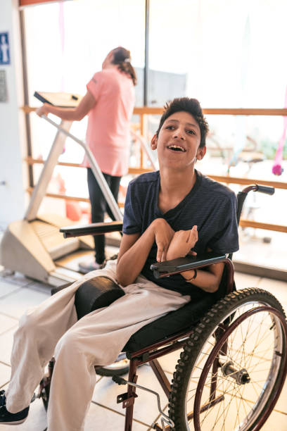 istock Working in nursery with children with learning difficulties - Boy in wheelchair with Celebral Palsy 1175250233