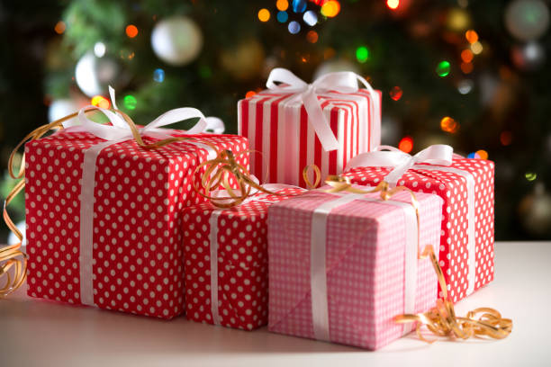 istock Christmas gifts on festive lights background 1175250239