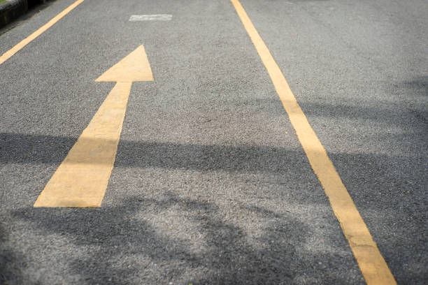 istock Arrow on the road and yellow color 1175250281