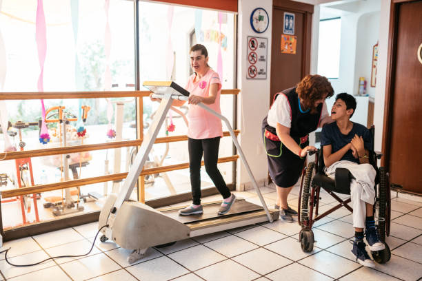 istock Working in nursery with children with learning difficulties - Boy in wheelchair with Celebral Palsy 1175250298