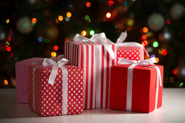 istock Christmas gifts on festive lights background 1175250302